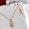 Rose-gold plated teardrop halo pendant in 925 silver with a pear moissanite