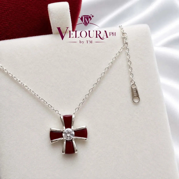 Cross pendant in 925 silver with red carnelian arms and a moissanite centre