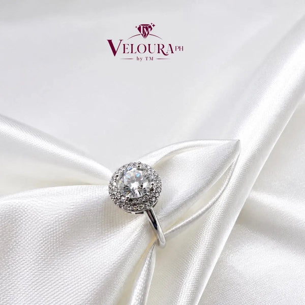 Petite round halo ring in 925 silver with a moissanite centre